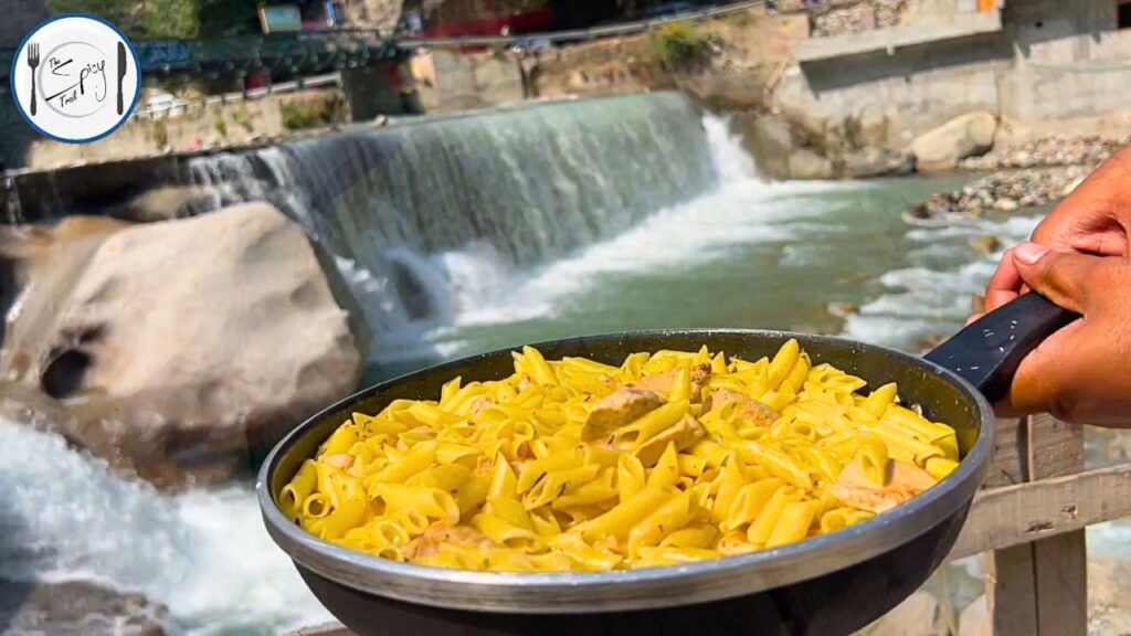 Featured image of One Pot Creamy Pasta Recipe By The Spicy Trail Cooked at Kundal Shahi Waterfall Kashmir One Pot Pasta Outdoor Cooking Travel Diaries 1.0