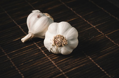 raw garlic in 2nd step of Easy Flower Cheese Garlic Bread Recipe By The Spicy Trail Easy Breakfast Kids Lunchbox Ideas