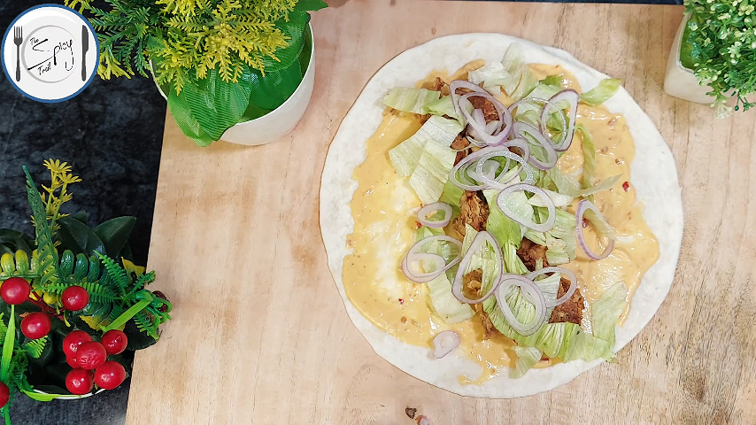 5th step of Tortilla Wrap Recipe By The Spicy Trail Crispy Chicken Wrap Chicken Tender Wrap Crunch Wrap